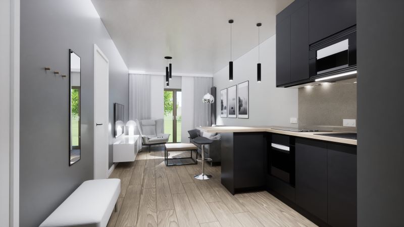 salon-z-otwartą-kuchnią-w-szarościach-bieli-i-antracycie