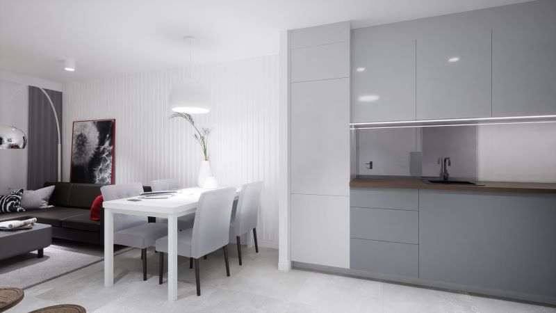 minimalistyczna-otwarta-kuchnia-w-szarościach-z-drewnianym-blatem