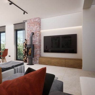 salon-z-kominkiem-na-tle-ceglanej-ściany
